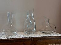 Group shot of three clear glass pieces