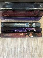Stacked view of all three incense varieties showing individual packs and display boxes