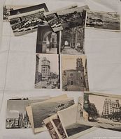 Group view of all 22 postcards spread out showing variety of Spanish scenes
