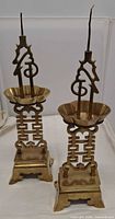 Full view of both brass incense holders showing design and size