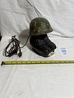 Full view of decanter lamp with tape measure and power cord