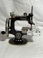 Front view of Singer Model 20 toy sewing machine