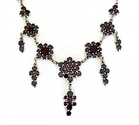 Front view showing cluster design and red stones