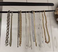 Full view of all 18 chains hanging on bar