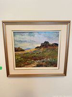 Front view of framed oil landscape painting