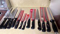 Full layout of 13 Henckels pieces on countertop