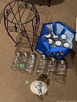 overall view of stand, jars in bag and out, figurine