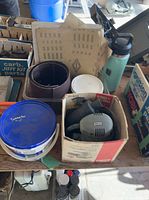 overview of lot showing sander box, sanding belts, sandpaper sheets, plastic tubs