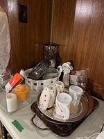 Overall lot showing mugs, trays, candles, figurine, glass and ceramic items