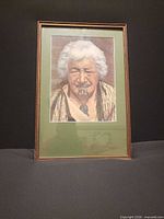 Front view of framed Māori portrait print showing entire frame and mat