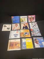 All 13 CDs laid out showing covers
