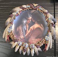 Front view showing artwork and sculpted feather border