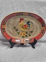Full view of oval ceramic platter on stand