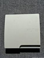 Top view of white PS3 console showing overall condition and color