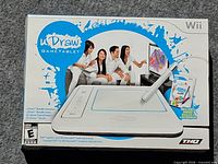 Front of original THQ uDraw GameTablet retail box illustrating tablet, stylus and game