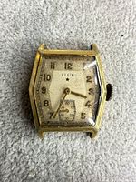 Front view showing dial, crystal condition, numerals, brand