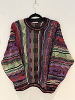 Front view of multicolour Coogi sweater on hanger