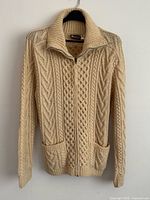 Front view showing overall style, pockets, zip, collar