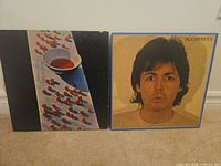 Both album covers side by side