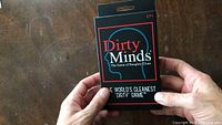 Front of Dirty Minds game box displaying logo and age rating 17+