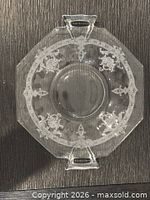 Top view of octagonal clear etched glass serving bowl showing handles and pattern
