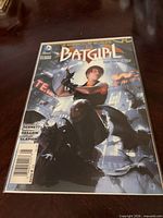 Front view of bagged Batgirl #25 comic displaying cover art and issue information