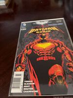 Front cover of Batman and Robin #11 variant comic in protective sleeve
