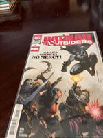 Front cover of bagged and boarded Batman and the Outsiders #12