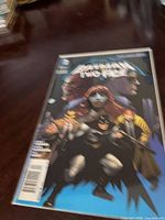 Front cover of Batman and Two-Face #24 in bag and board