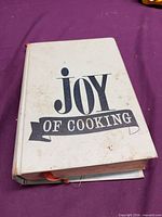 Front cover of Joy of Cooking hardcover showing title design and staining