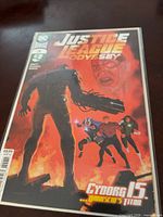 Front view of bagged Justice League Odyssey #24 variant comic