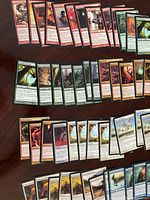 Spread of red, green, and multicolor cards on table