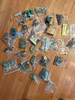 All bags of assorted fasteners and blade packs spread on floor