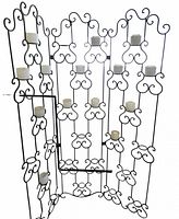 Full view of three-panel wrought iron room divider with candle holders and glass cups