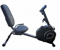 Right side view of entire recumbent bike showing seat, backrest, frame, and flywheel housing
