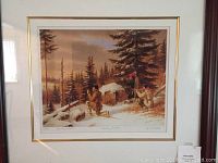 Close-up of the 'Caribou Hunters' print showing two hunters in winter forest with rifles, detailed snow and tree background.