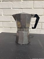 Full view of aluminum moka pot showing octagonal design and handle