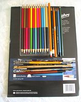 Sketchbook base with coloured pencil tray and loose tools on top