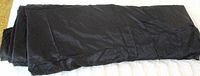 Folded length of black shiny fabric