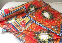 Full length of rolled fabric showing overall print and colors