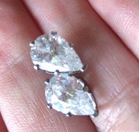 Front view showing pear-shaped stones and prong setting