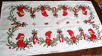 Full view of table runner showing elf and pine motif