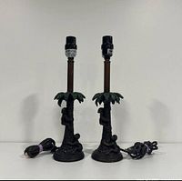 Front view of both palm tree lamps with cords