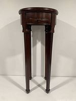 Full frontal view showing entire height, legs and drawer front