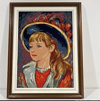 Full view of framed needlepoint portrait