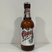 Front view showing Coors Light label and overall bottle form