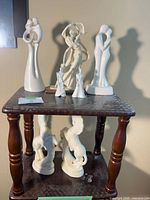 Full view of all figurines on two-tier stand