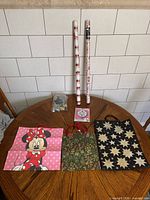Full lot showing three gift bags, two wrapping paper rolls, balloons