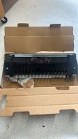 Jig inside original corrugated box with hardware bags