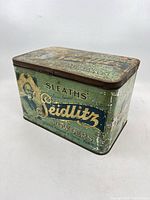 Front and side view of Sleaths' Seidlitz Powders tin